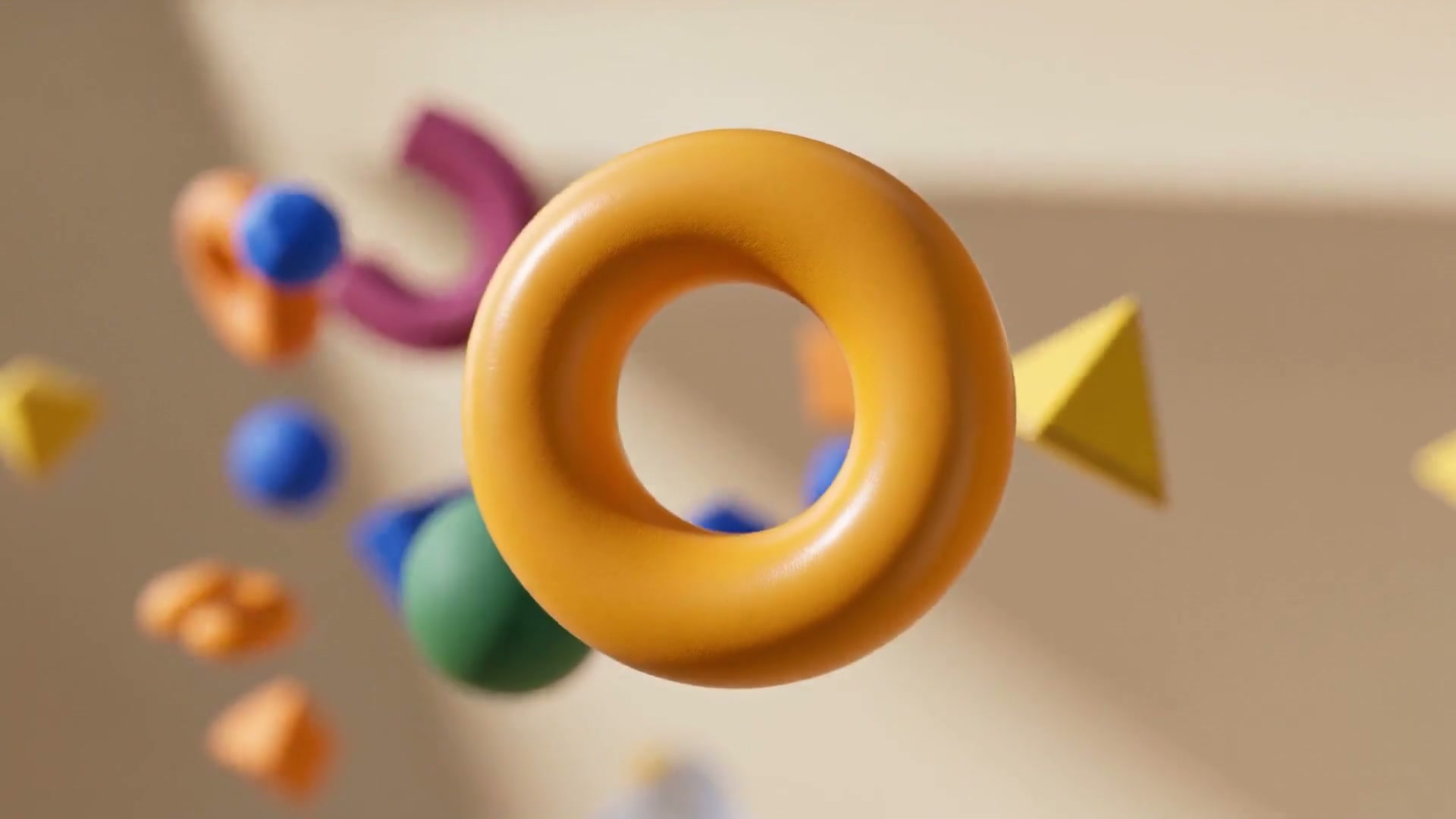 A close-up of the golden ring moving among blue, green and pink shapes in the Square DC film.