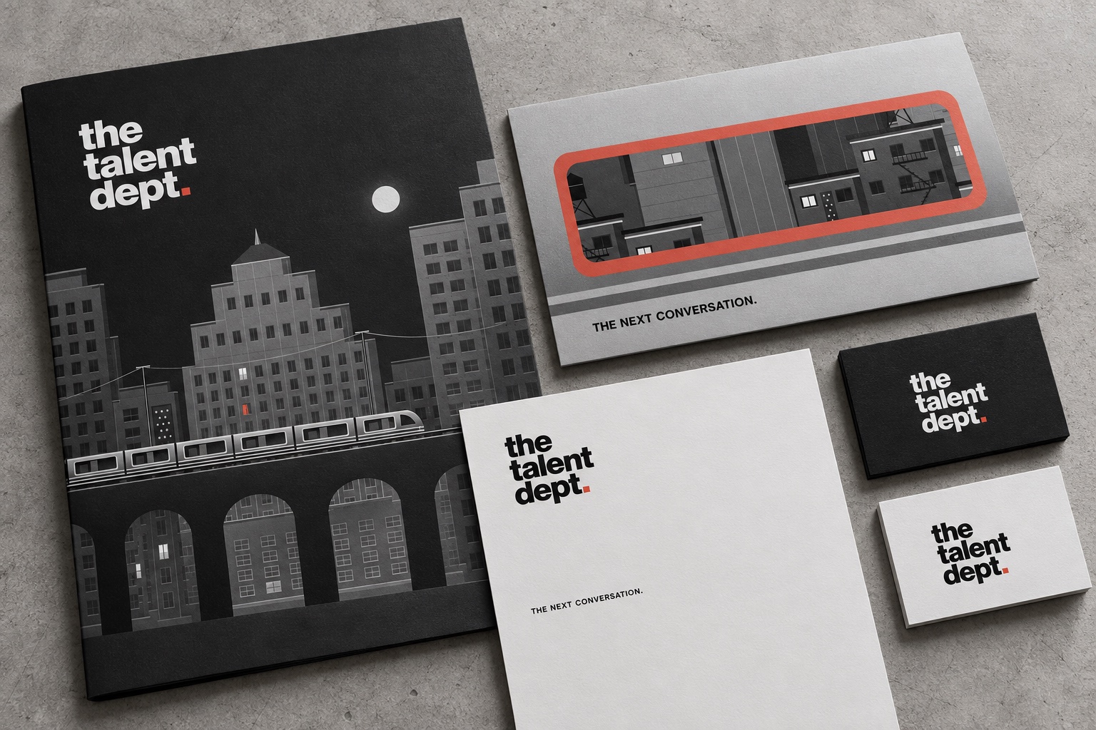 The Talent Dept. stationery mockup with graphite city artwork, silver train-window invitation, letterhead and business cards.